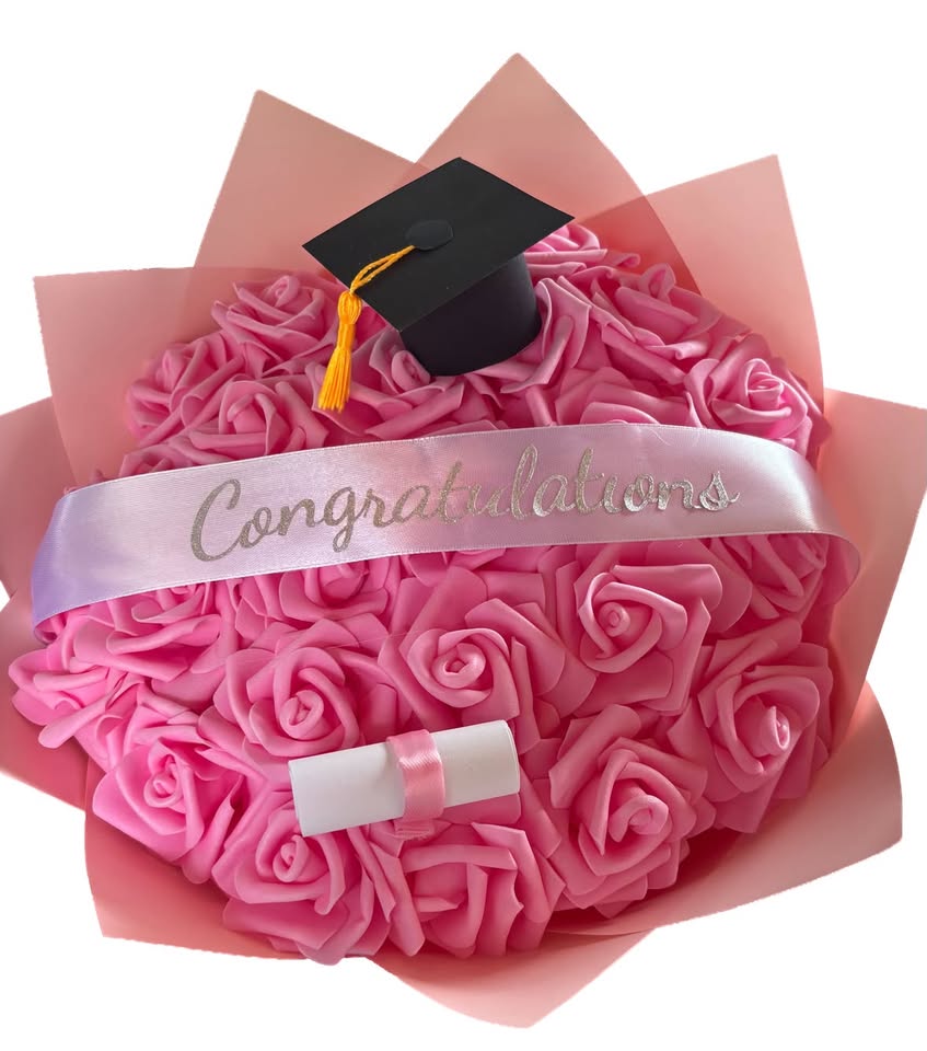 A pink foam rose bouquet with a graduation cap and Congratulations ribbon